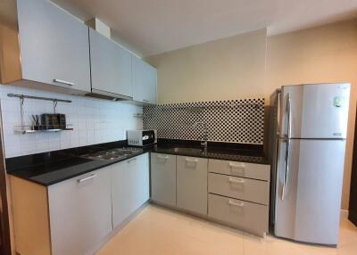 Modern kitchen with sleek cabinetry and appliances