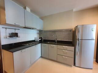 Modern kitchen with sleek cabinetry and appliances