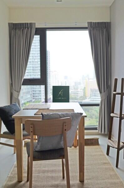 Well-lit dining area with view of the city