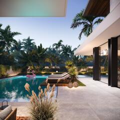 Modern outdoor pool area with lounge chairs and lush greenery