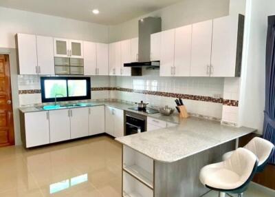 Modern kitchen with white cabinets and sleek design