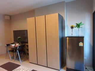 Dining area with table, chairs, and nearby storage