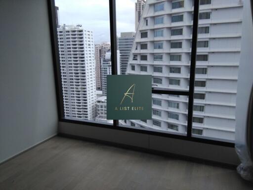 Bedroom with large windows and city view