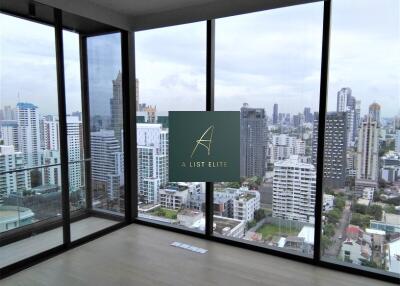 Modern living room with large glass windows and city view