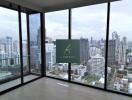 Modern living room with large glass windows and city view