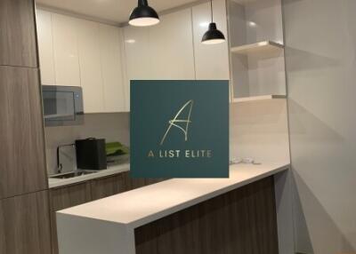 Modern kitchen with wooden cabinets and a breakfast bar