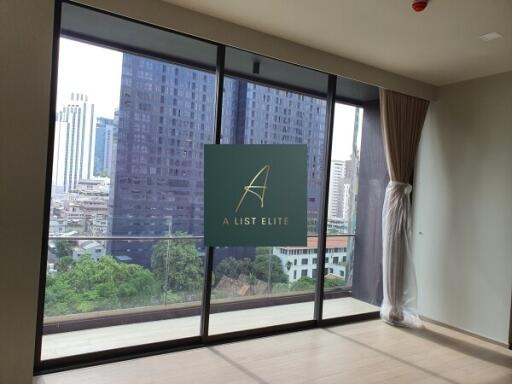 Living room with large windows and city view