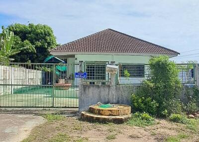 Front view of a house with a fenced yard