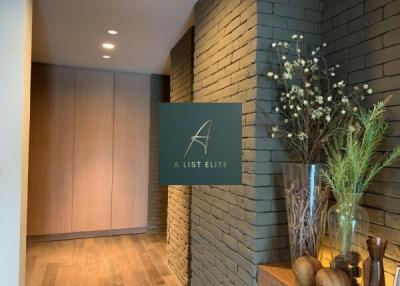 Modern hallway with wooden flooring and decorative plants