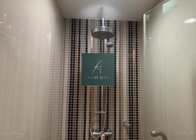 Modern shower area with stylish tiling