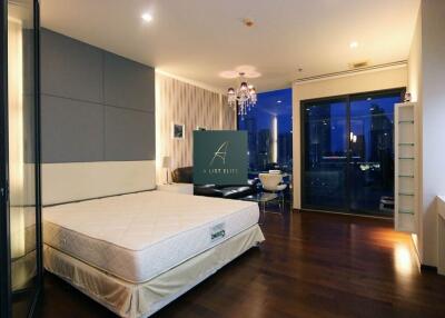 spacious bedroom with city view