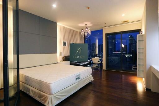 spacious bedroom with city view