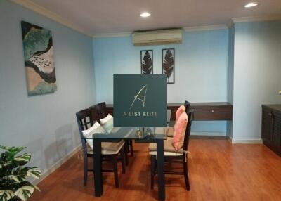 Dining area with glass table and wooden chairs