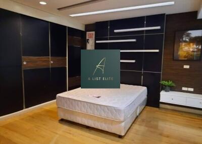 Modern bedroom with mattress and built-in wardrobes