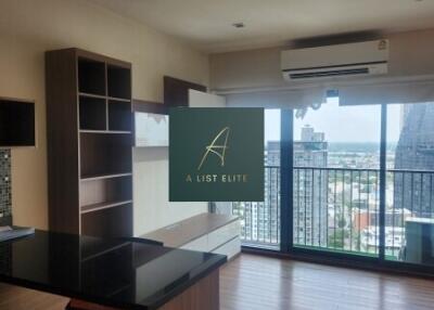 Spacious living room with balcony and city view