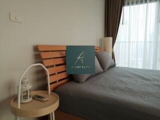 Cozy bedroom with a wooden headboard and side table