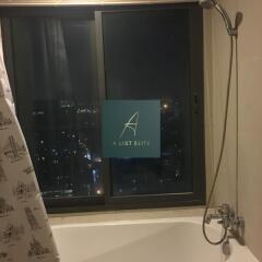 Bathroom with city view and shower