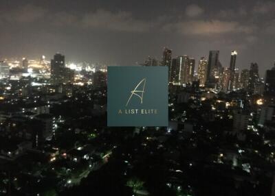 Cityscape view at night with illuminated buildings