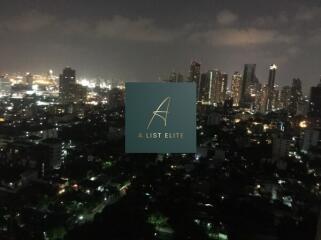 Cityscape view at night with illuminated buildings