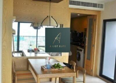 Modern dining area with wooden furniture and stylish lighting