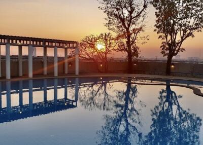 Outdoor swimming pool at sunset