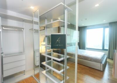 Spacious bedroom with built-in closet and large window