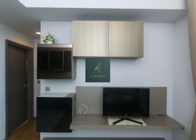 Modern living room with TV and wall-mounted cabinets