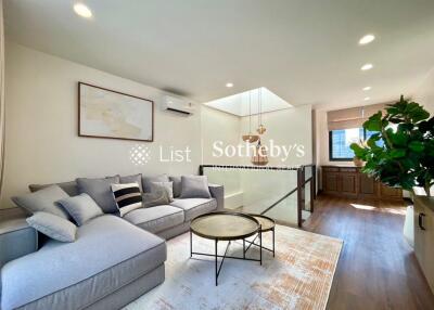 Modern living room with L-shaped sofa and coffee table