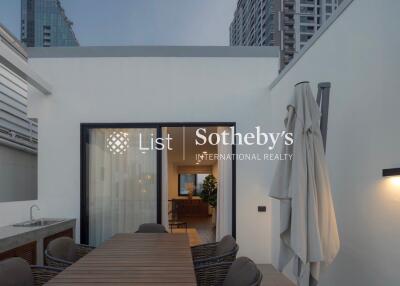 Modern balcony with dining table and view of indoor living area