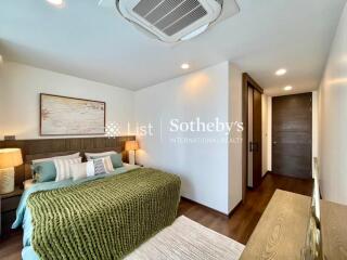 Modern bedroom with green accent bedding