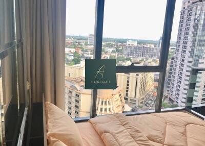 Bedroom with a city view and large window