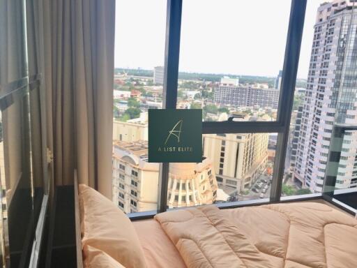 Bedroom with a city view and large window