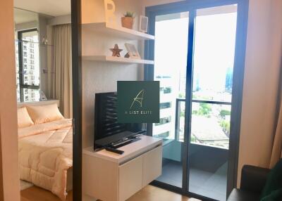 Modern living area with a view of the bedroom and balcony