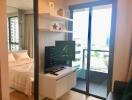 Modern living area with a view of the bedroom and balcony