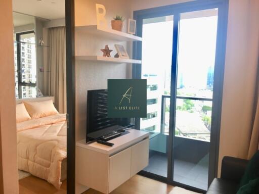 Modern living area with a view of the bedroom and balcony