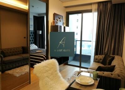 Living room with balcony view and cozy furnishing