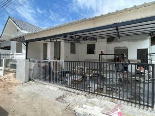 Front view of house under renovation