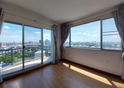 Bright living room with large windows and city view