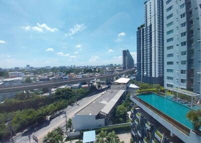 City view with high-rise buildings and pool