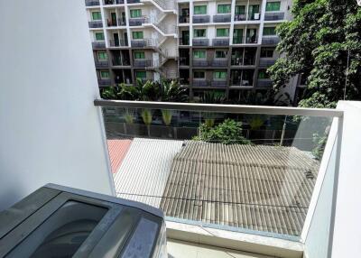 View from balcony overlooking neighboring building