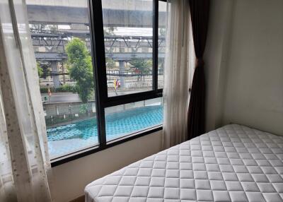 Bedroom with a view of a swimming pool