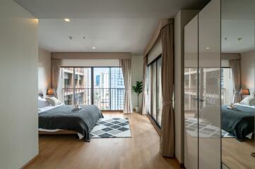 Spacious and modern bedroom with city view