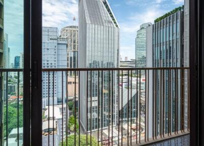 view from a window showcasing a cityscape with skyscrapers