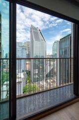 view from a window showcasing a cityscape with skyscrapers