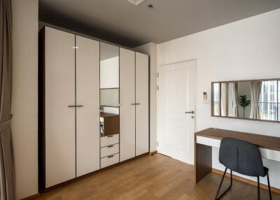 Modern bedroom with wardrobe and desk