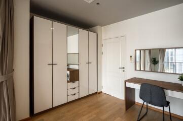 Modern bedroom with wardrobe and desk