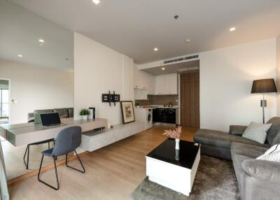 Modern living room with open-plan kitchen