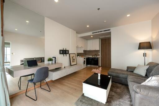 Modern living room with open-plan kitchen