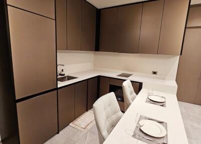 Modern kitchen with brown cabinets and breakfast bar