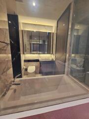 Modern bathroom with bathtub and toilet